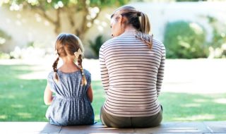 a mum talking to her young daughter