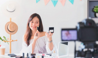 an asian woman creating a make-up video