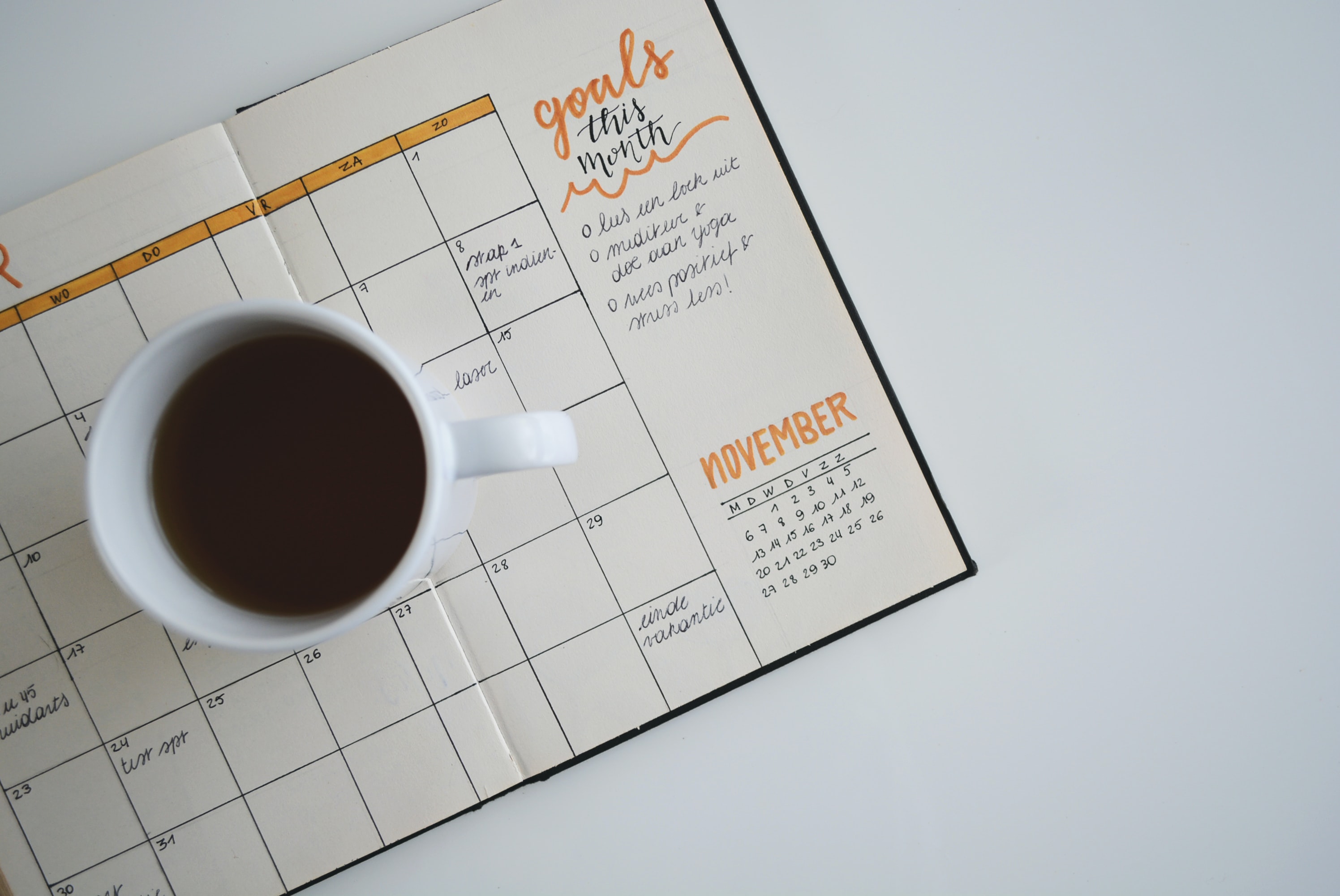 a mug of coffee on top of a scheduler