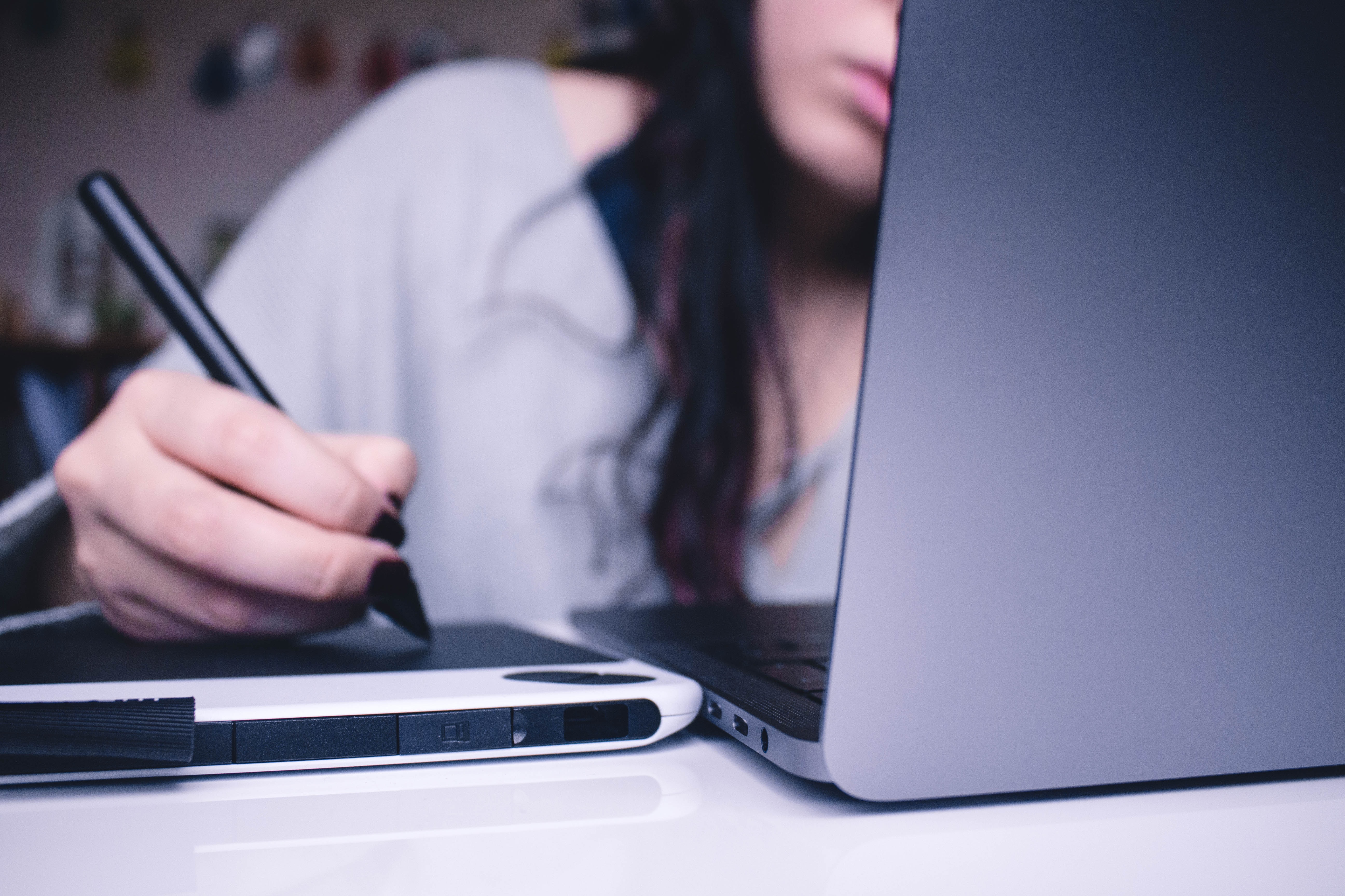 woman using a drawing pad at work