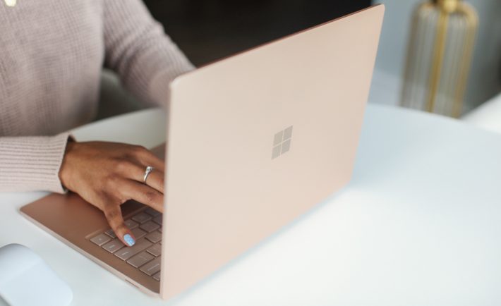 a person typing on a laptop