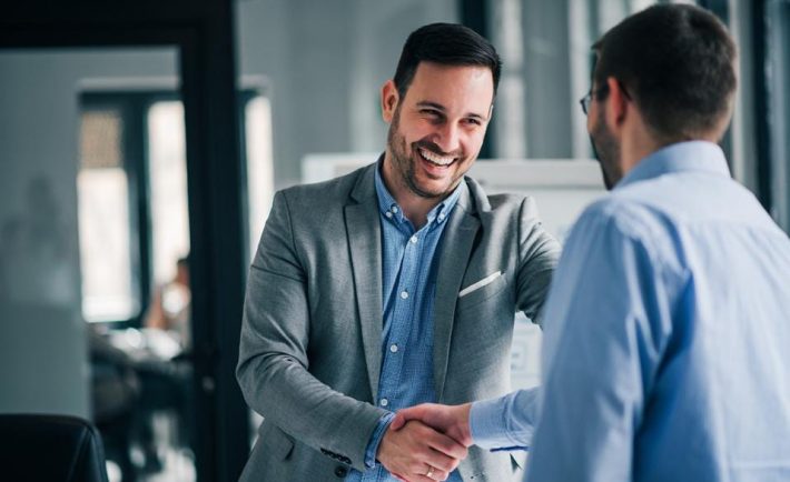 two men shaking hands