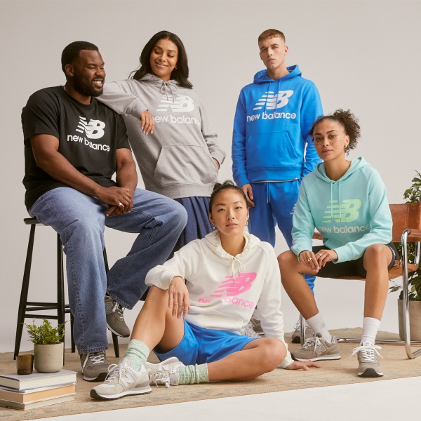 A group of people sitting on a bench Description automatically generated with low confidence