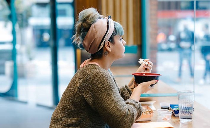 woman eating alone