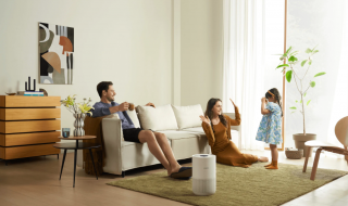 a family sitting in the living room with Xiaomi Smart Air Purifier 4 Compact