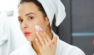 woman applying a face mask