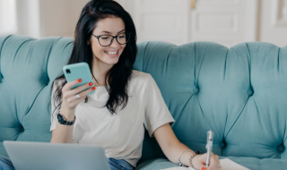 woman working from home an writing something on a notebook