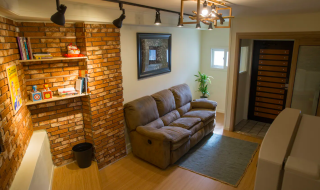 living room view with brick walls