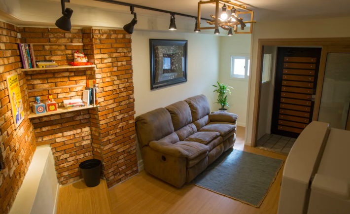 living room view with brick walls