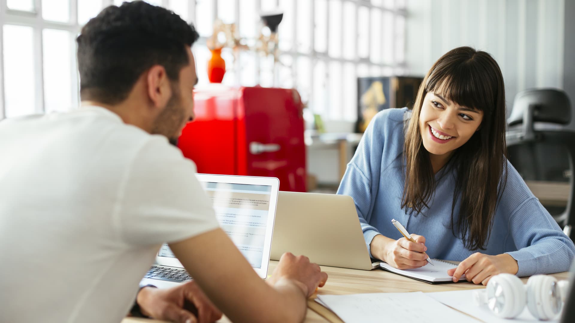 woman smiling at man in the office