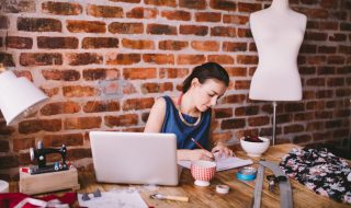 woman working on her fashion designs