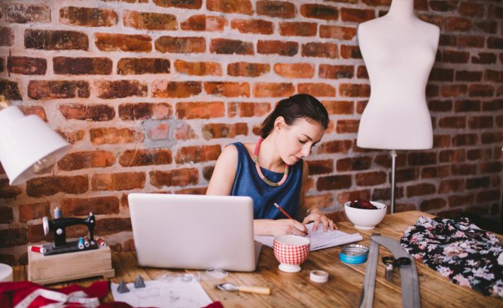 woman working on her fashion designs