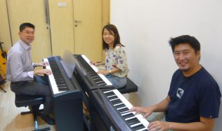adults having piano lessons
