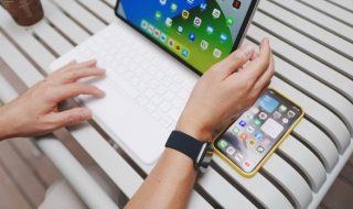 a portable laptop and a phone on the table