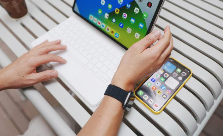 a portable laptop and a phone on the table