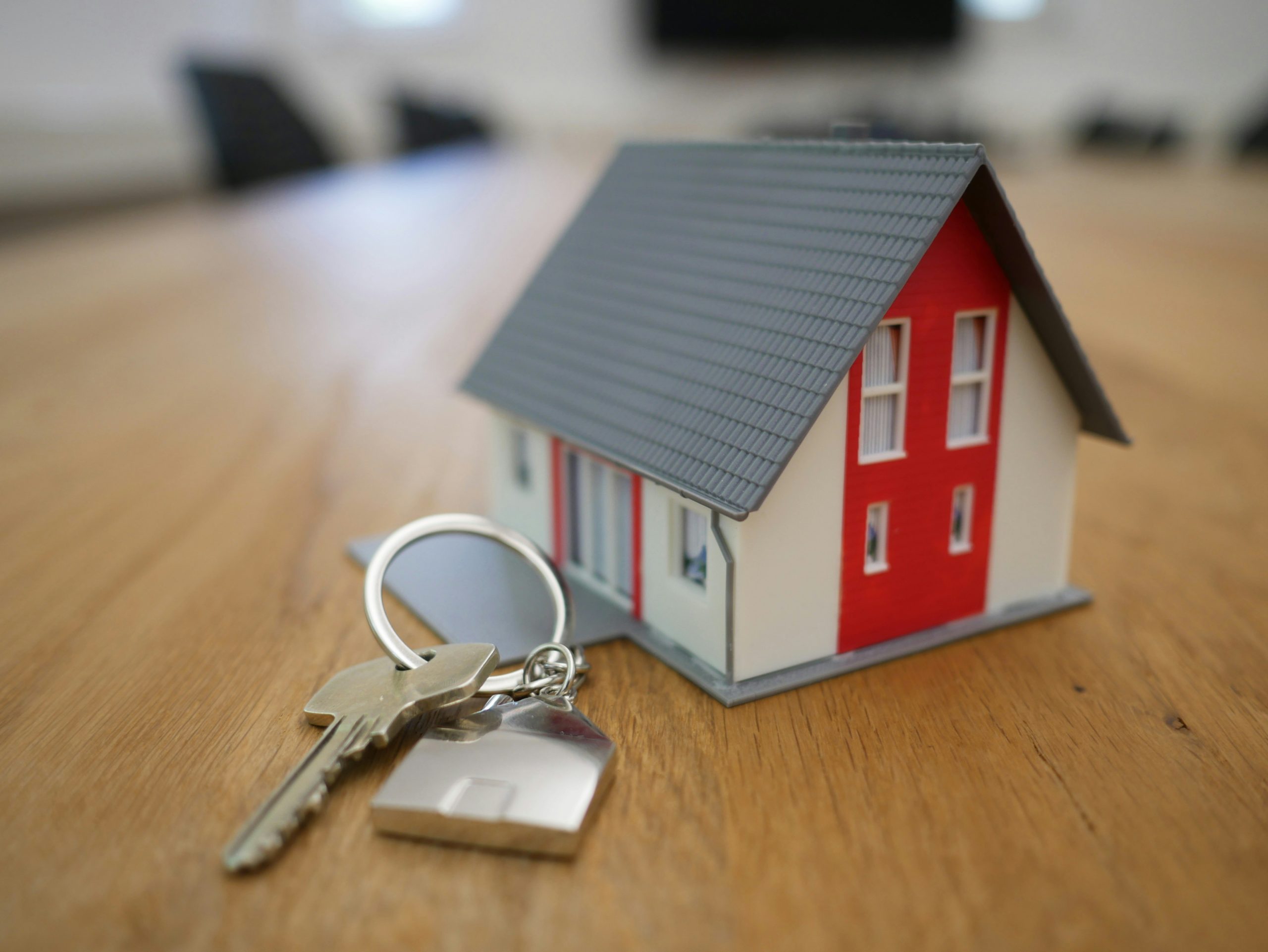 keys beside a miniature house
