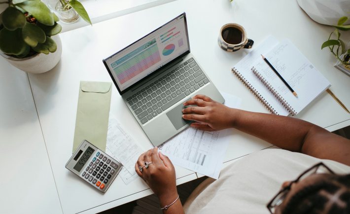 a lady sitting at a table budgeting
