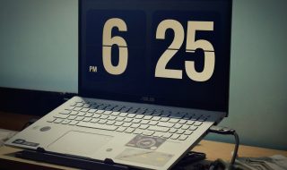 open laptop displaying time on screen