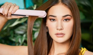 woman straightening her hair