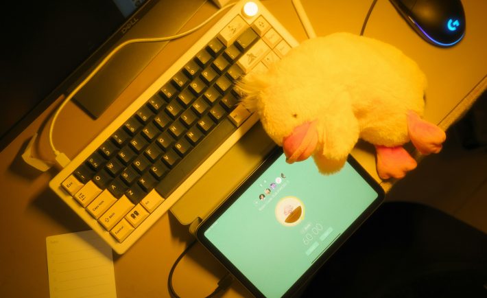 a keyboard, tablet, and a plush toy