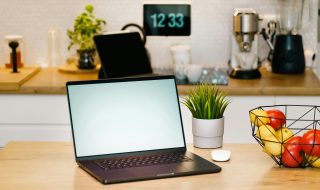 a laptop on a kitchen coucnter
