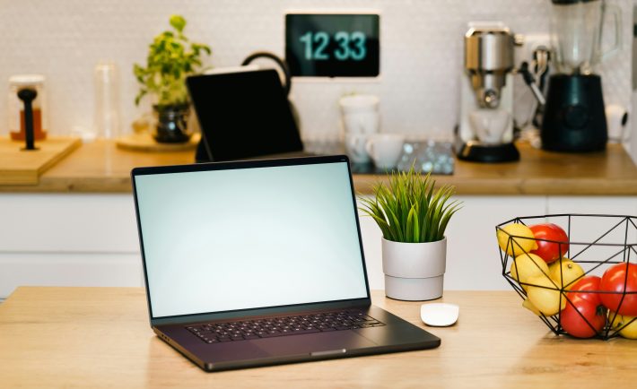 a laptop on a kitchen coucnter